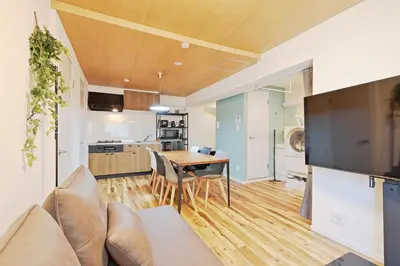a living room with a couch and a table at V Close to Shinjuku Kabukicho Korean Town FrWIFI F in Tokyo