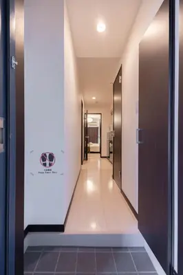 a corridor of a hospital hallway with a hallway at Asakusa Good Place Unmanned Hotel in Tokyo