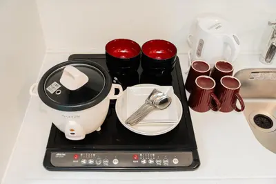 a black tray with utensils on a kitchen counter at Shinjuku luxury high-rise apart ment in Tokyo