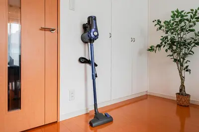 a video camera on a tripod next to a door at Shinjuku luxury high-rise apart ment in Tokyo
