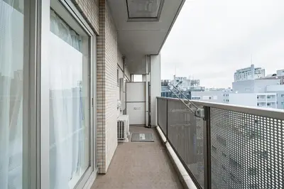 an apartment balcony with a view of a city at Shinjuku luxury high-rise apart ment in Tokyo