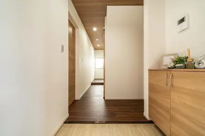 a hallway with white walls and wood floors at 99, Higashi-tateishi A 2nd and 3rd floor apartment, \u6771\u7acb\u77f3A 2F,3F in Tokyo