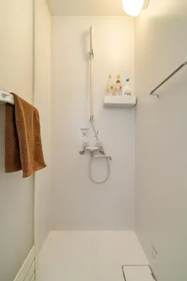 a white bathroom with a shower and a sink at 99, Higashi-tateishi A 2nd and 3rd floor apartment, \u6771\u7acb\u77f3A 2F,3F in Tokyo