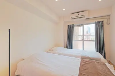 a small bedroom with a bed and a window at V Close to Shinjuku Kabukicho Korean Town FrWIFI G in Tokyo