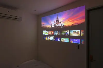 a flat screen tv on a wall in a bedroom at V Close to Shinjuku Kabukicho Korean Town FrWIFI G in Tokyo
