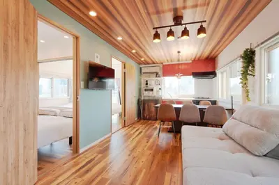a living room with a couch and a dining room at V Close to Shinjuku Kabukicho Korean Town FrWIFI H in Tokyo