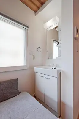 a white bathroom with a sink and a mirror at V Close to Shinjuku Kabukicho Korean Town FrWIFI H in Tokyo