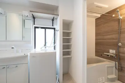 a small bathroom with a sink and a shower at \u30b0\u30ed\u30fc\u30d9\u30eb \u30b6 \u30af\u30ec\u30b9\u84b2\u7530 in Tokyo