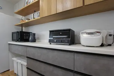 a kitchen counter with a toaster and a printer on it at Tokyo villa Ryogoku in Tokyo