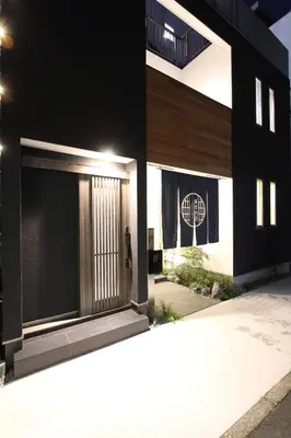 a building with a door with a flag on it at Tokyo villa Ryogoku in Tokyo