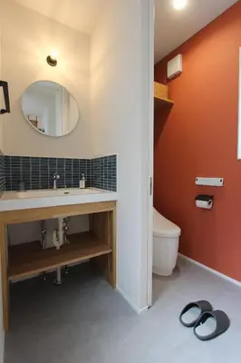 a bathroom with a sink and a mirror and a toilet at Tokyo villa Ryogoku in Tokyo