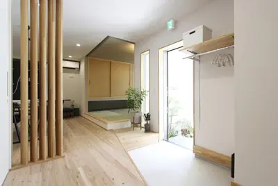 a room with a hallway with wooden floors and large glass doors at Tokyo villa Ryogoku in Tokyo