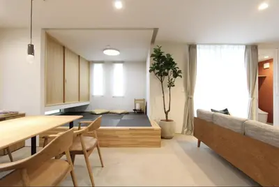 a living room with a dining table and a couch at Tokyo villa Ryogoku in Tokyo
