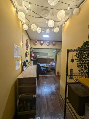 a room with a table and a living room at Matsuri House 20min to Ueno in Tokyo
