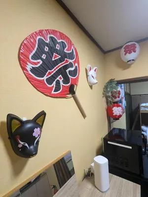 a room with a cat sign on the wall at Matsuri House 20min to Ueno in Tokyo