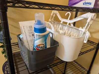 a shopping cart with a toothbrush and a bottle of bleach at Matsuri House 20min to Ueno in Tokyo