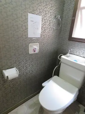 a bathroom with a white toilet and a sink at 20min to Haneda airport Vista Ikegami in Tokyo