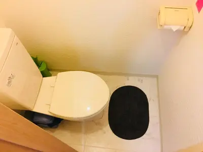 a bathroom with a white toilet with a black lid at Shinjuku \u767e\u4eba\u753a 704-SJ0167 in Tokyo