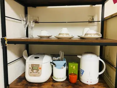 a shelf with cups and appliances on it at Shinjuku \u767e\u4eba\u753a 704-SJ0167 in Tokyo