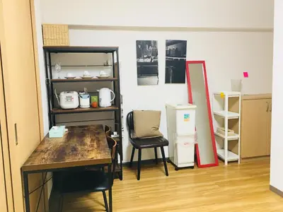 a room with a table and chairs and a shelf at Shinjuku \u767e\u4eba\u753a 704-SJ0167 in Tokyo