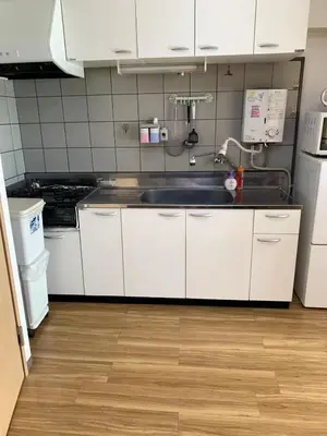 a kitchen with white cabinets and a sink at Shinjuku \u767e\u4eba\u753a 704-SJ0167 in Tokyo