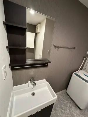 a bathroom with a sink and a mirror and a toilet at 5minutes from Shinjuku Shin-Okubo Station-k101 in Tokyo