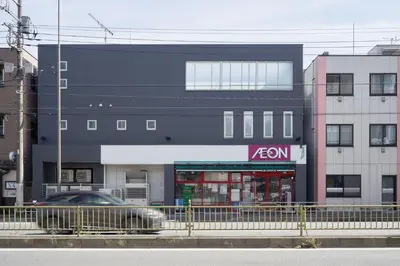 a black building with a zon sign on it at APRO Stay \u54c1\u5ddd in Tokyo