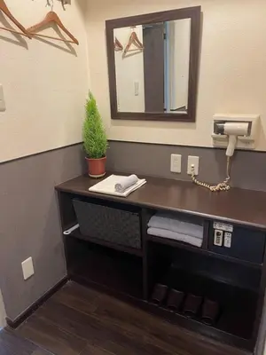 a bathroom with a sink with a phone and a mirror at Hotel Grand Fort - Vacation STAY 19351v in Tokyo