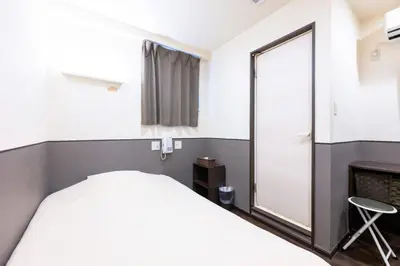 a bedroom with a bed and a mirror at Hotel Grand Fort - Vacation STAY 19351v in Tokyo