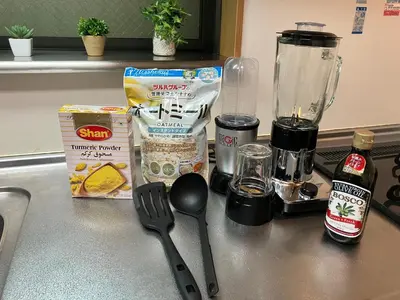 a counter with some food and a blender and a spoon at Entire Hotel Beside Asakusa, Ueno, Akihabara and Tokyo Skytree tower between 3 Train Stations and Contains 3 Bedrooms, 2 Bathrooms and 2 toilets for 14 guests in Tokyo