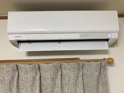 a printer on a wall next to a curtain at Entire Hotel Beside Asakusa, Ueno, Akihabara and Tokyo Skytree tower between 3 Train Stations and Contains 3 Bedrooms, 2 Bathrooms and 2 toilets for 14 guests in Tokyo