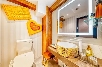 a bathroom with a toilet and a sink at SweetsHotel Ikebukuro -Adult Only in Tokyo