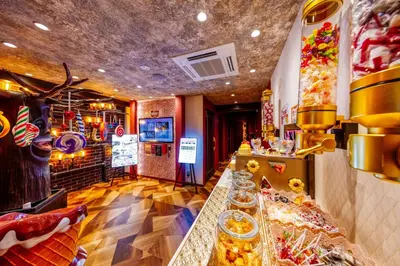 a restaurant with a buffet line with food at SweetsHotel Ikebukuro -Adult Only in Tokyo