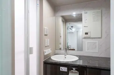 a bathroom with a sink and a mirror at Contel\u660e\u5927\u524d in Tokyo