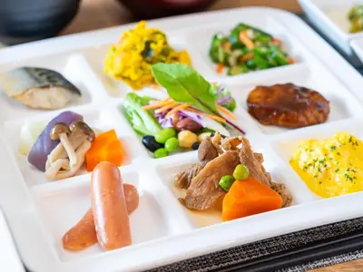 a white plate with different types of food on it at Super Hotel Ikebukuro-Eki Kitaguchi in Tokyo
