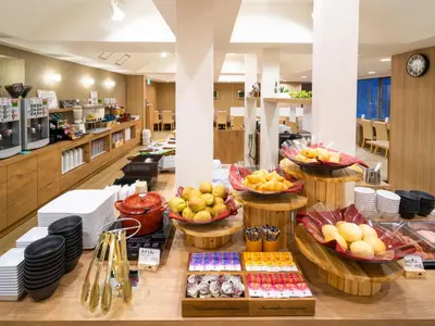 a buffet of food on a table in a restaurant at Super Hotel Ikebukuro-Eki Kitaguchi in Tokyo