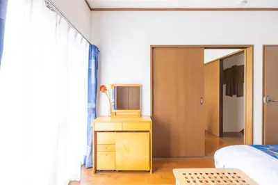 a bedroom with a bed and a tv on a dresser at NEW Koenji House 3BR Family Friendly Haven in Tokyo