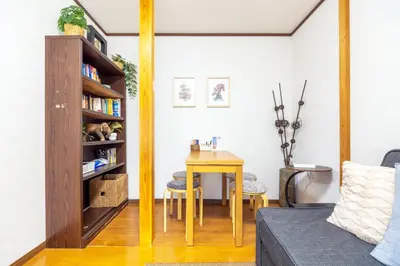a living room with a table and a mirror at NEW Koenji House 3BR Family Friendly Haven in Tokyo