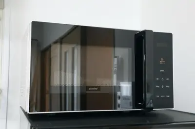 a microwave oven sitting on top of a shelf at Voere\u5927\u4e95\u753a 201 in Tokyo