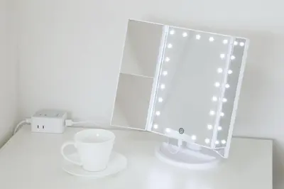 a white table with a mirror and a cup at Voere\u5927\u4e95\u753a 302 in Tokyo