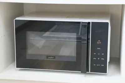 a microwave oven sitting on top of a shelf at Voere\u5927\u4e95\u753a 302 in Tokyo