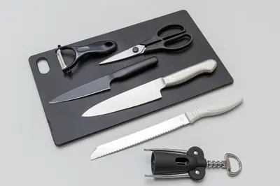 a pair of scissors on a black cutting board at IROHA STAY HANEDA - Family-Friendly Home Stay near Haneda with Great Access to Tokyo & Yokohama in Tokyo