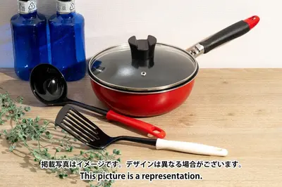 a pot on a table with a spatula and a whisk at \u30a8\u30b9\u30ab\u30eb\u690e\u540d\u753a in Tokyo