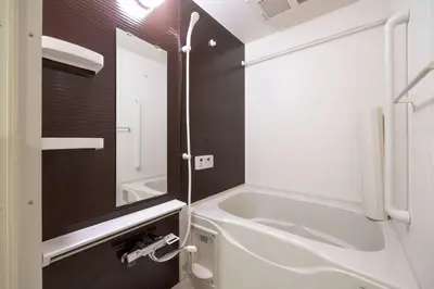 a bathroom with a tub and a sink and a mirror at \u30f4\u30a3\u30e9\u4e21\u56fd in Tokyo