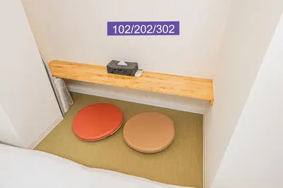 a room with two round tables on the floor at Shinjuku Downtown 1min walk to metro Cozy APT in Tokyo