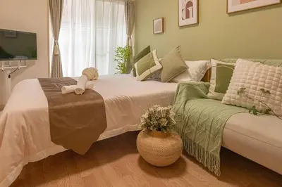 a bedroom with a bed with a teddy bear on it at 3mins from Nakano subway,Direct to Shinjuku,Up to 4 People in Tokyo