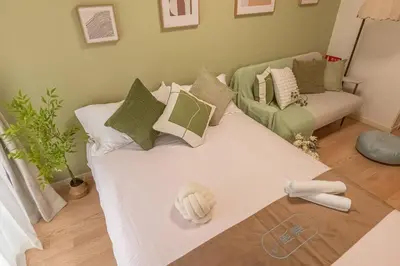 a bedroom with a bed with a baseball on it at 3mins from Nakano subway,Direct to Shinjuku,Up to 4 People in Tokyo