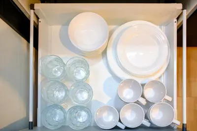 a group of plates and bowls in a drawer at \u30bb\u30f3\u30c8\u30ec\u6cb3\u7530\u753a in Tokyo