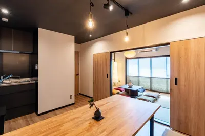 a kitchen and living room with a table in a room at \u30bb\u30f3\u30c8\u30ec\u6cb3\u7530\u753a in Tokyo