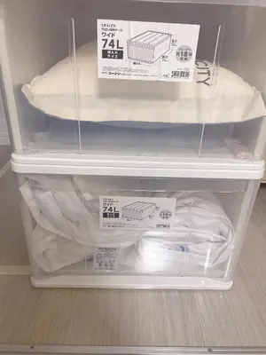 a refrigerator with a mattress and signs on it at \u6771\u4eac\u5c0f\u5ca9\u4e0e\u623f\u4e1c\u540c\u4f4fmishe in Tokyo